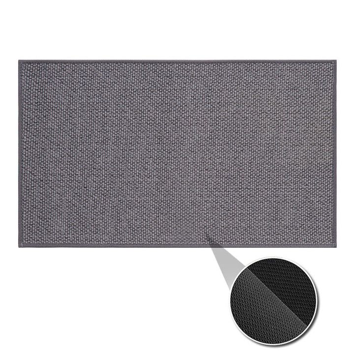 Machine washable woven indoor door mat with a timeless weave pattern, non-slip backing, and plush polypropylene surface.