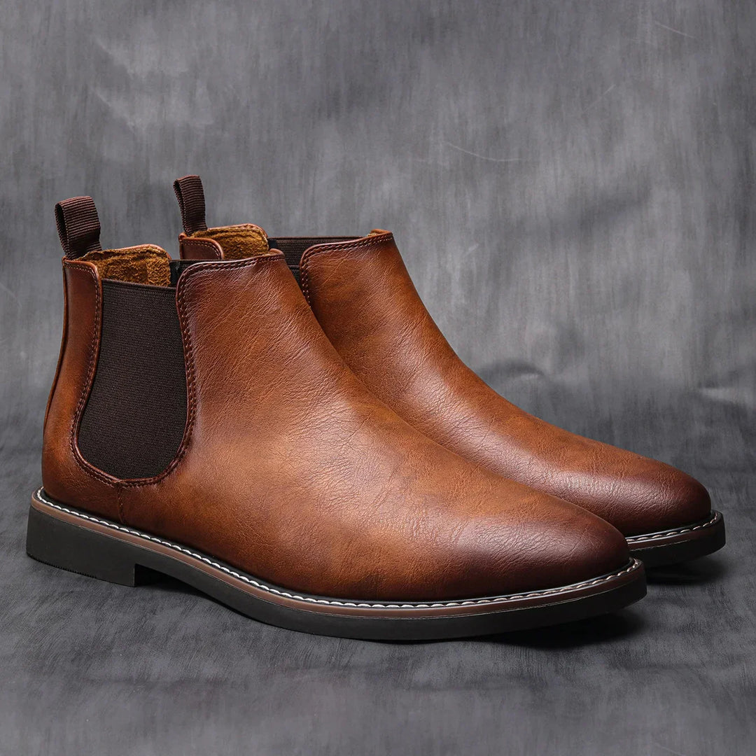 Men's black Chelsea boots. Effortless slip-on style, versatile for casual wear, workwear, and dress occasions.