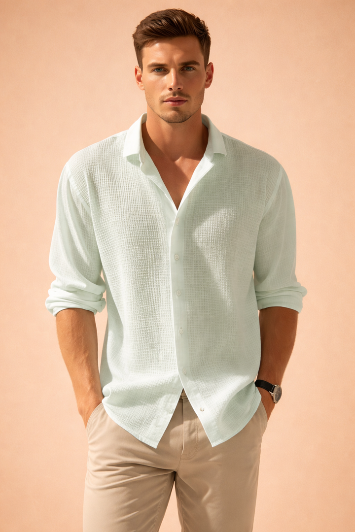 Textured men's long sleeve button-up shirt, offering a relaxed fit & light comfort for summer casual wear.