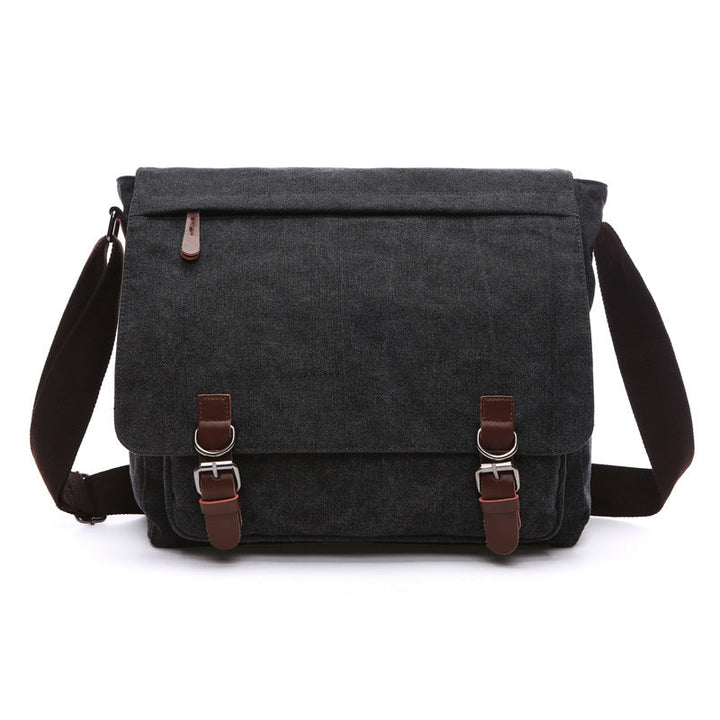Close-up of a men's rugged canvas shoulder bag, showcasing textured fabric & secure buckles. Great for daily carry.