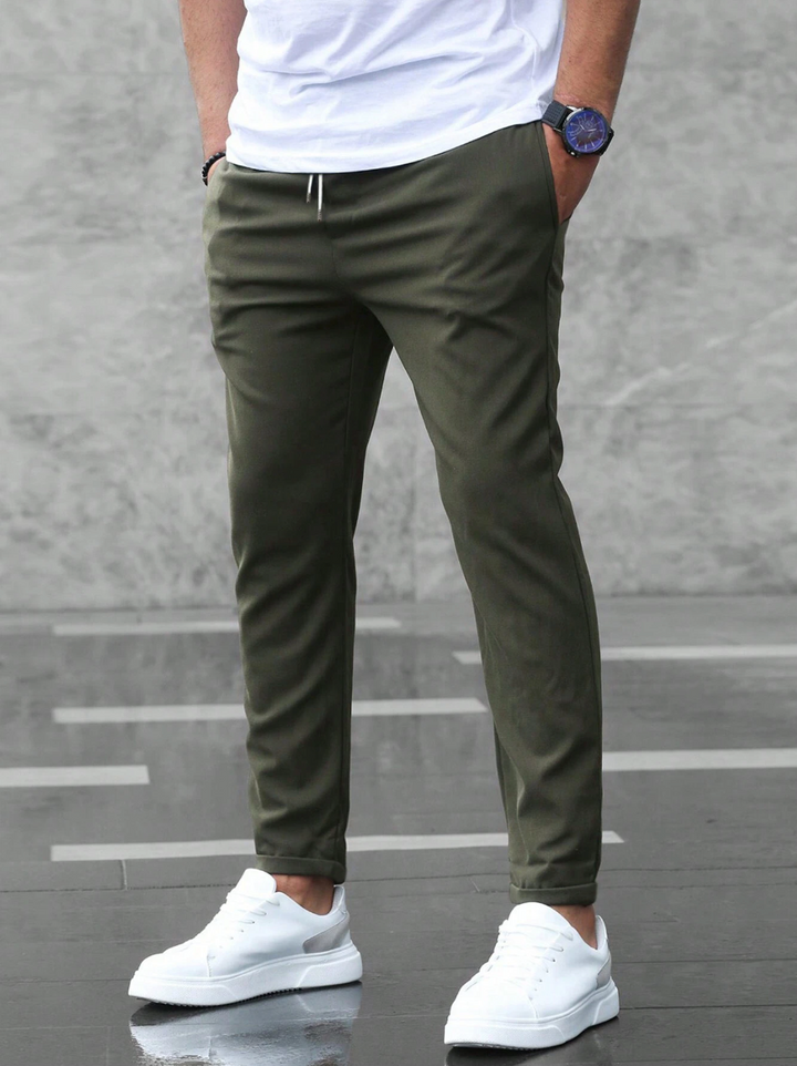Textured men's flexible slim-fit pants, designed for ultimate comfort and versatile style in any setting.