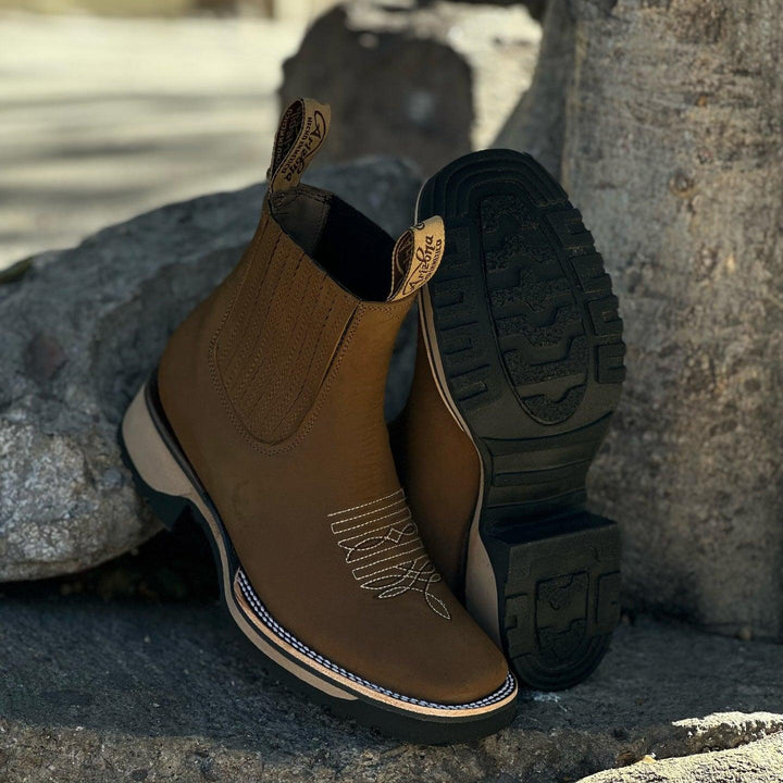 Embroidered men's cowboy ankle boots. Brown leather-look pull-on Western boots with elastic panels & rugged sole.