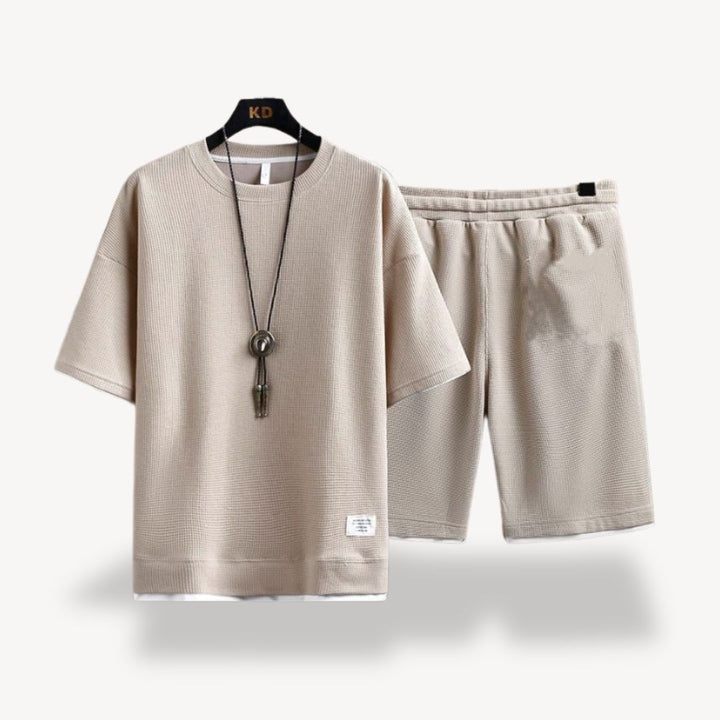 "Men wearing dark gray cotton jersey shorts set, showcasing relaxed fit and minimalist design for casual comfort"