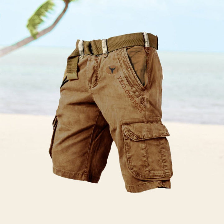 "Men's black durable utility cargo shorts with multiple pockets for outdoor activities, shown in a stylish front view."