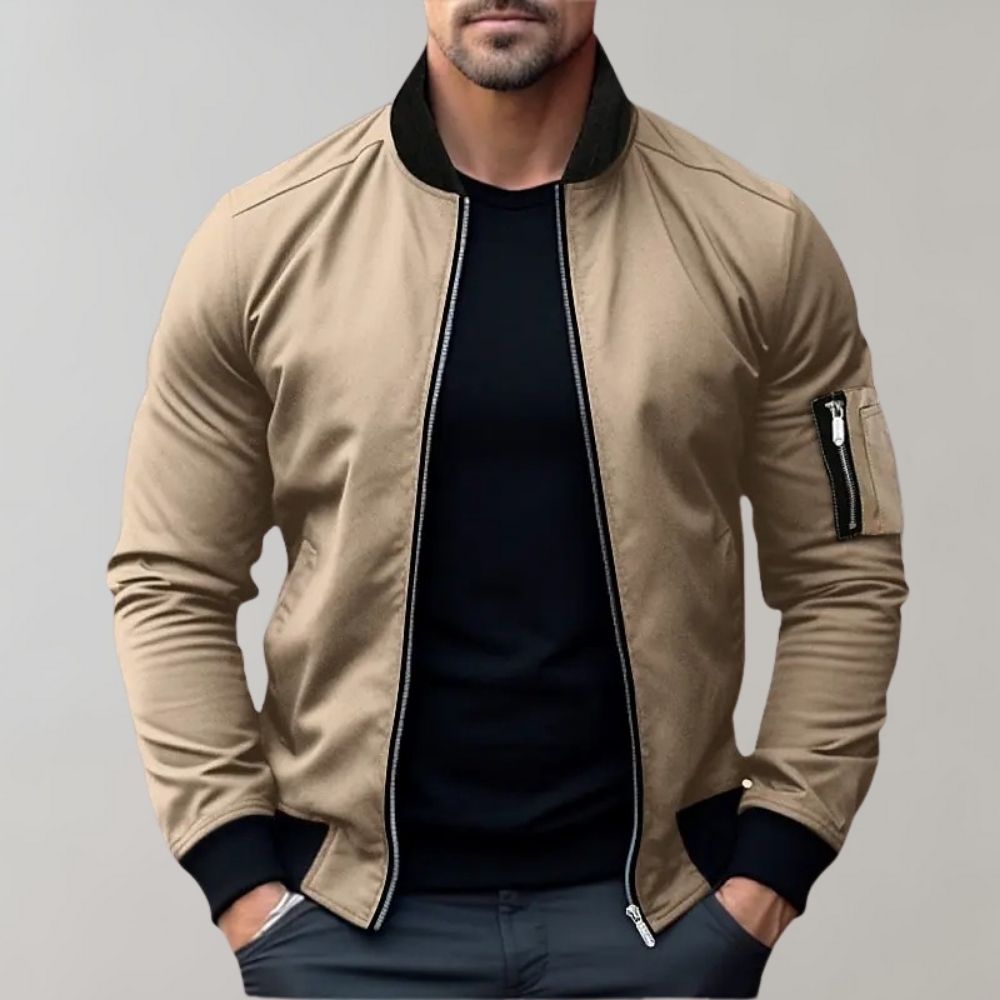 "Men's blue bomber jacket with zipper pockets, stylish fit, lightweight fabric, perfect for cool evenings."