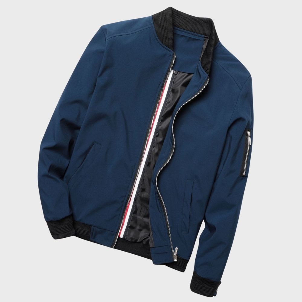 "Men's blue bomber jacket with zipper pockets, stylish fit, lightweight fabric, perfect for cool evenings."
