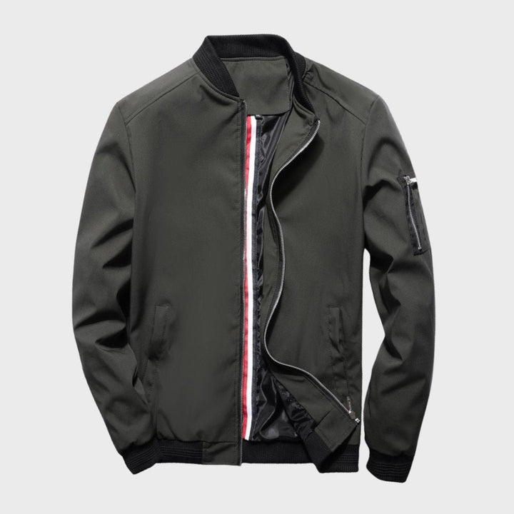 "Men's blue bomber jacket with zipper pockets, stylish fit, lightweight fabric, perfect for cool evenings."