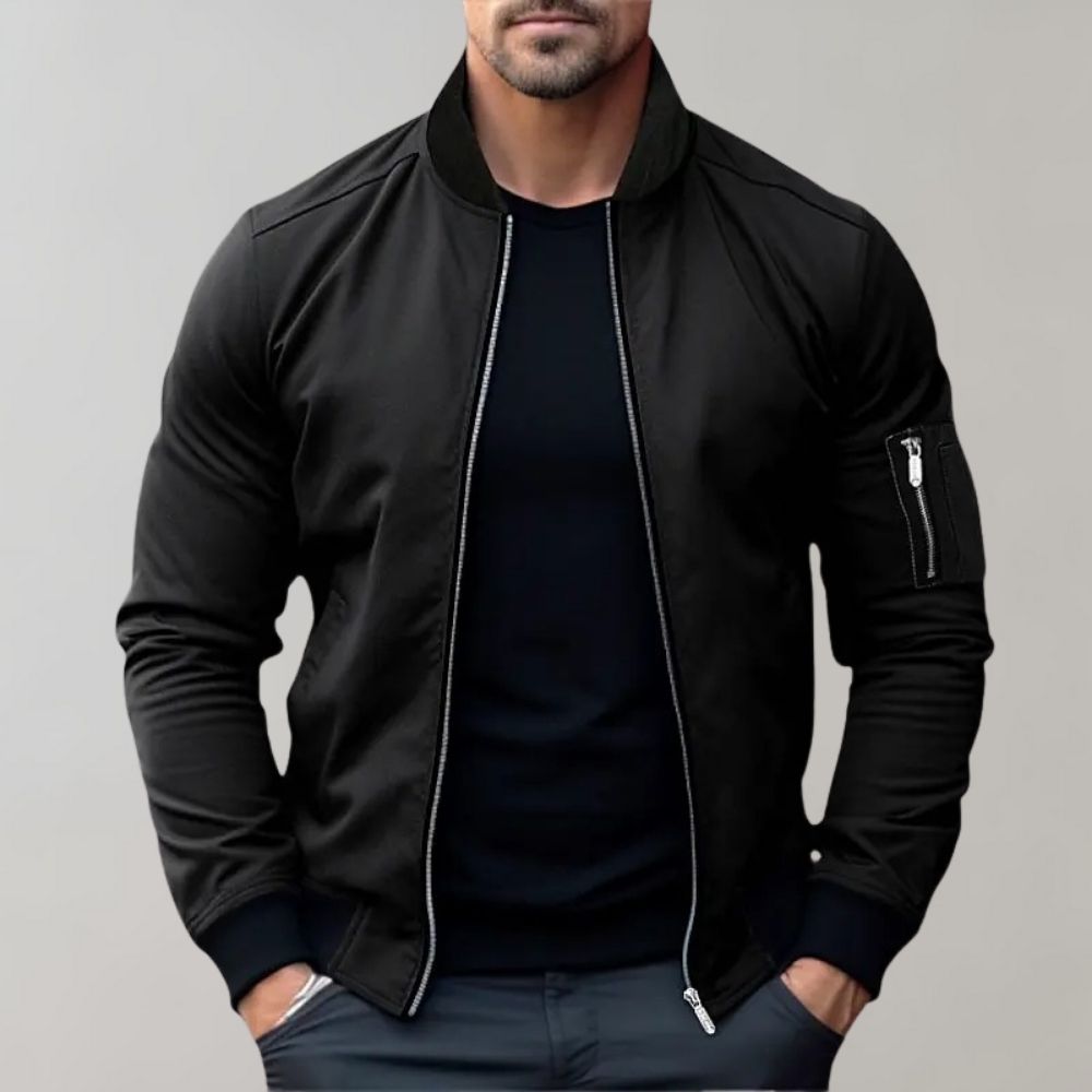 "Men's blue bomber jacket with zipper pockets, stylish fit, lightweight fabric, perfect for cool evenings."