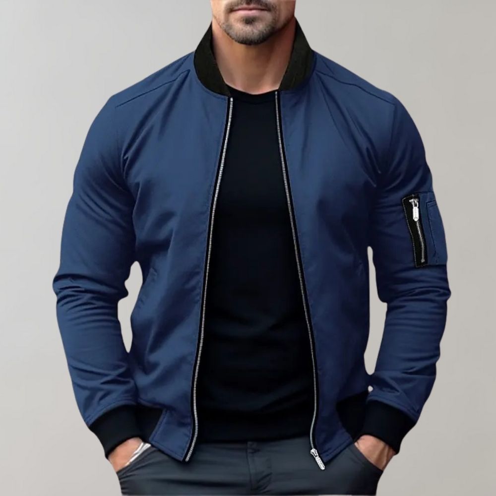 "Men's blue bomber jacket with zipper pockets, stylish fit, lightweight fabric, perfect for cool evenings."