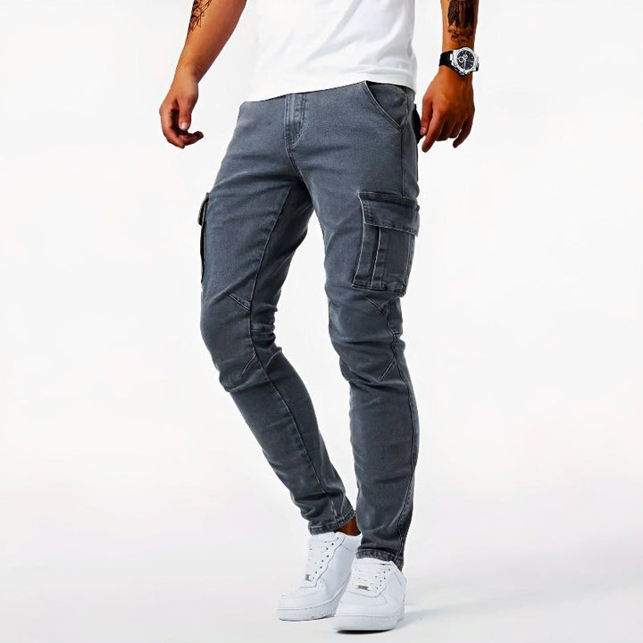 Men's cargo jeans with multi-pockets, textured fabric, and relaxed fit in black, grey, and light blue for all-season wear.