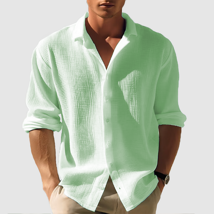 Men's casual button-down shirt, sleek design, versatile for casual or semi-formal wear, shown in light blue fabric.