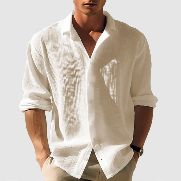 Men's casual button-down shirt, sleek design, versatile for casual or semi-formal wear, shown in light blue fabric.