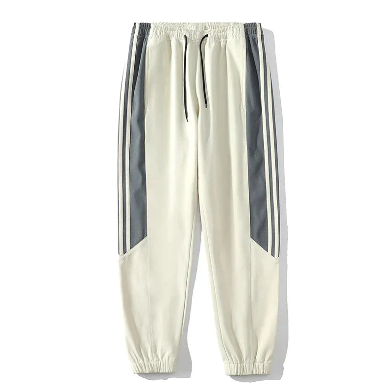 "Men's casual sports tracksuit with stylish stripe design, lightweight jacket and jogger pants, perfect for active or casual 