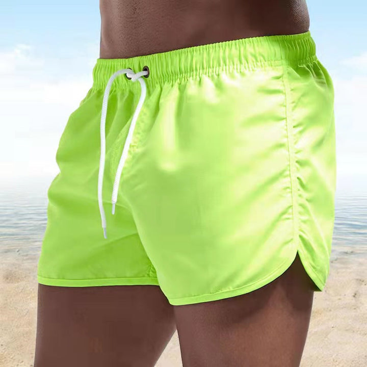 Men's casual swim shorts with adjustable waistband, relaxed fit, and versatile style, perfect for beach and pool days.