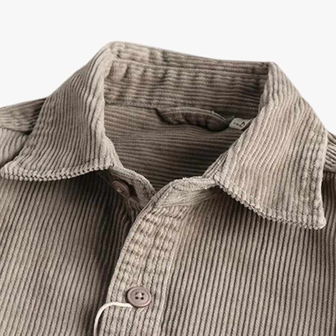 Men's classic orange corduroy shirt with button-down front and textured fabric, ideal for layering and timeless style.