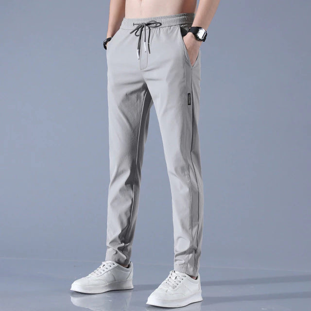 Men's cotton chino pants with a sleek, modern fit in versatile shades, perfect for formal or casual occasions.