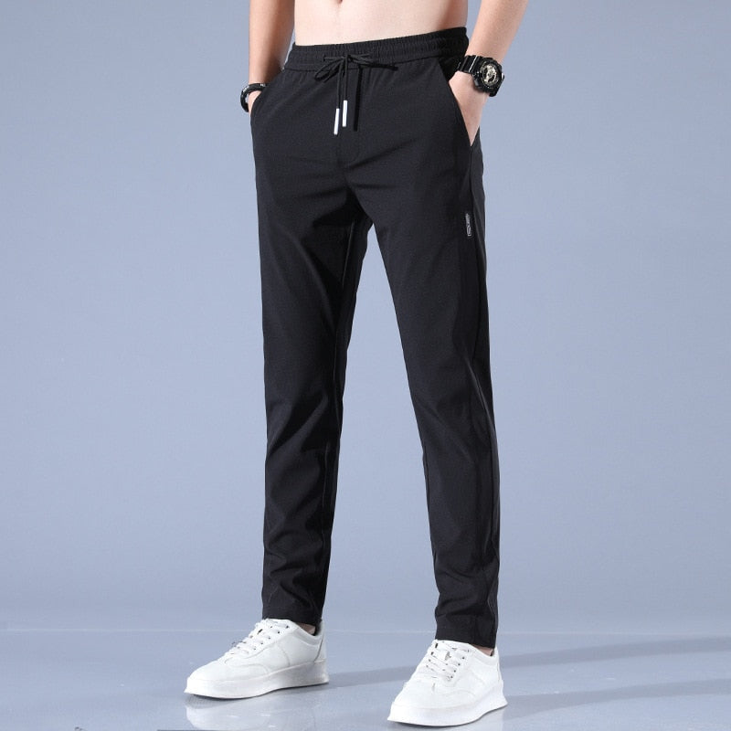 Men's cotton chino pants with a sleek, modern fit in versatile shades, perfect for formal or casual occasions.