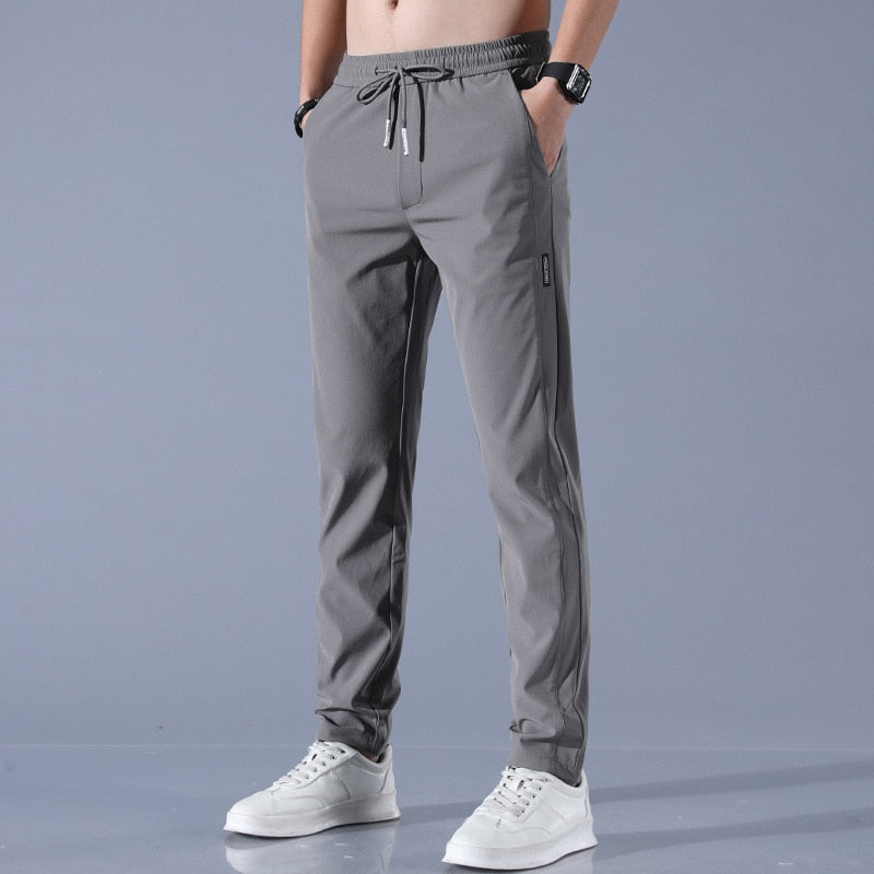 Men's cotton chino pants with a sleek, modern fit in versatile shades, perfect for formal or casual occasions.