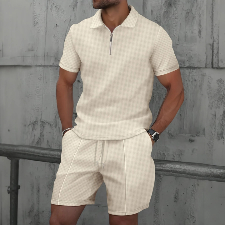 "Men's cotton co-ord set with a short-sleeved zip-neck polo and drawstring shorts, perfect for casual summer style."