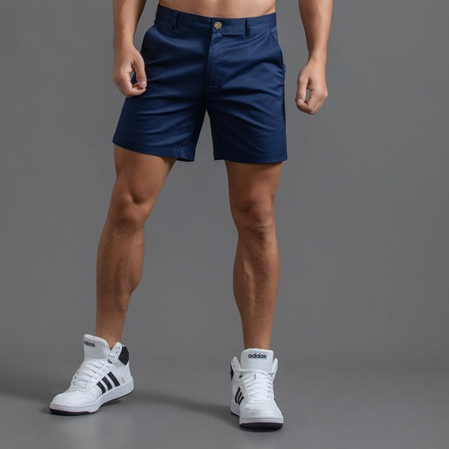 Men's cotton knee-length chino shorts in khaki, featuring a classic summer design and breathable material, ideal for casual w