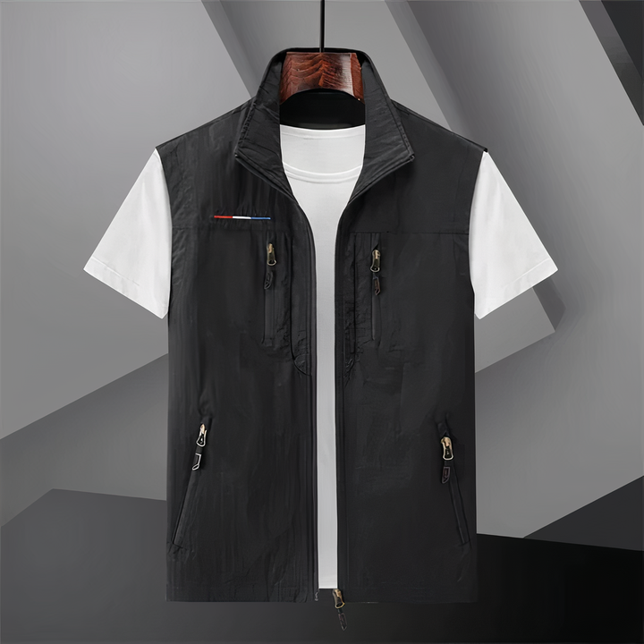 Men's cotton utility vest with multi-pockets, shown in black; ideal for outdoor activities like hiking and fishing.