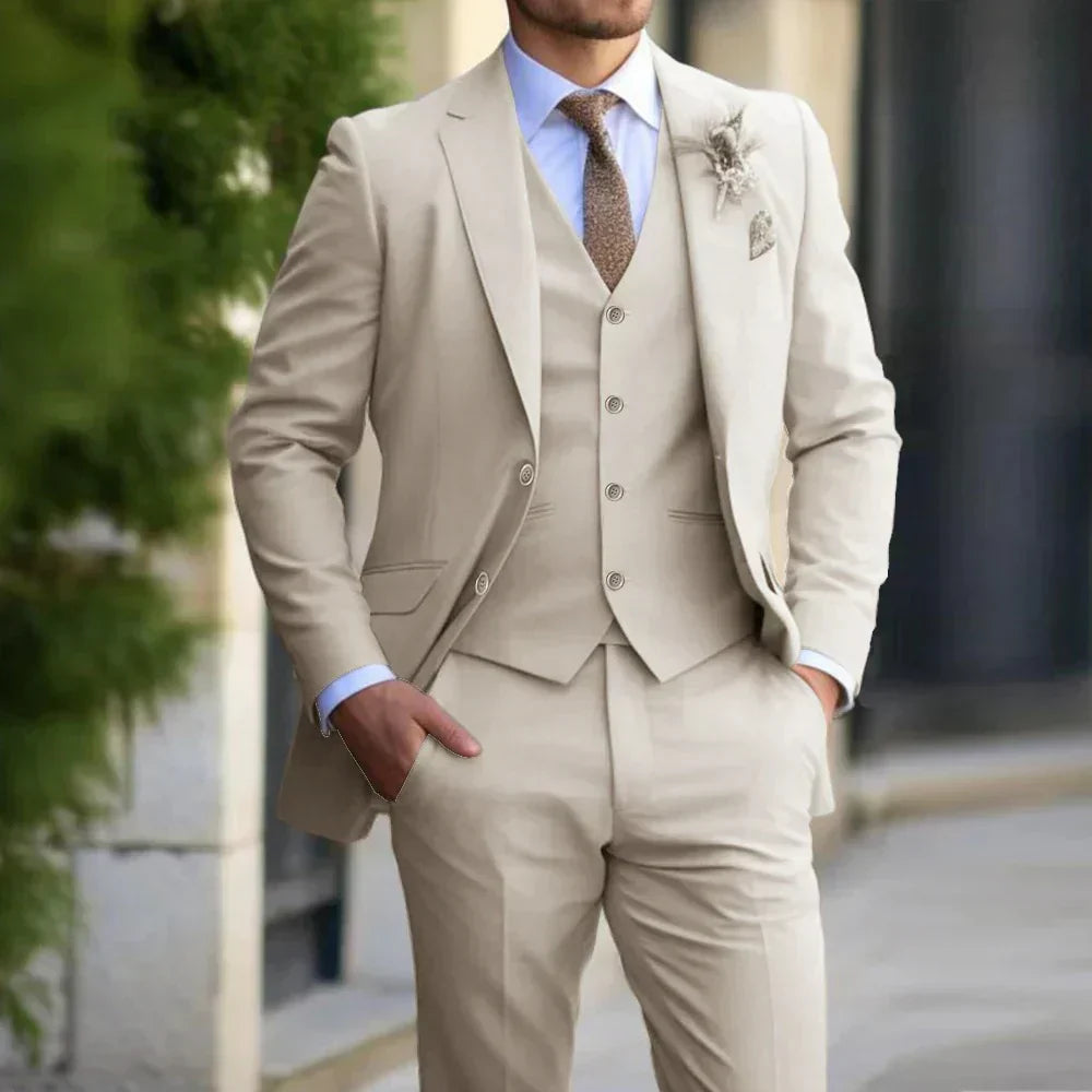 Men's elegant 3-piece slim fit suit in beige; includes blazer, vest, trousers. Ideal for formal occasions. Sophisticated styl