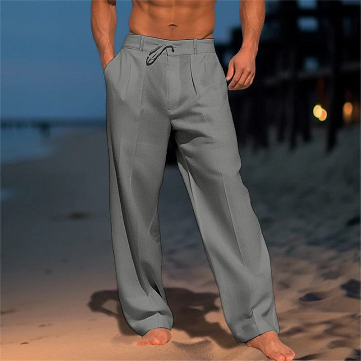 Men's full-length linen trousers with drawstring waist, relaxed fit, and pleated front, ideal for casual wear in warm weather