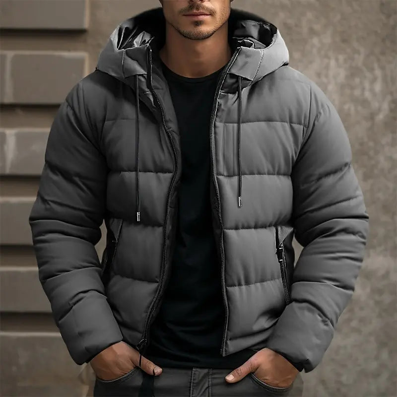 Men's insulated puffer jacket with hood, sleek black quilted design, ideal for winter warmth and style.