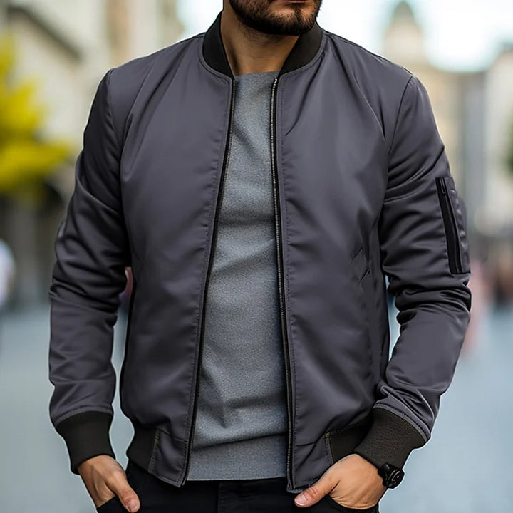 Men's lightweight bomber jacket with ribbed trim, regular fit, sleek design, versatile casual style, and breathable fabric.