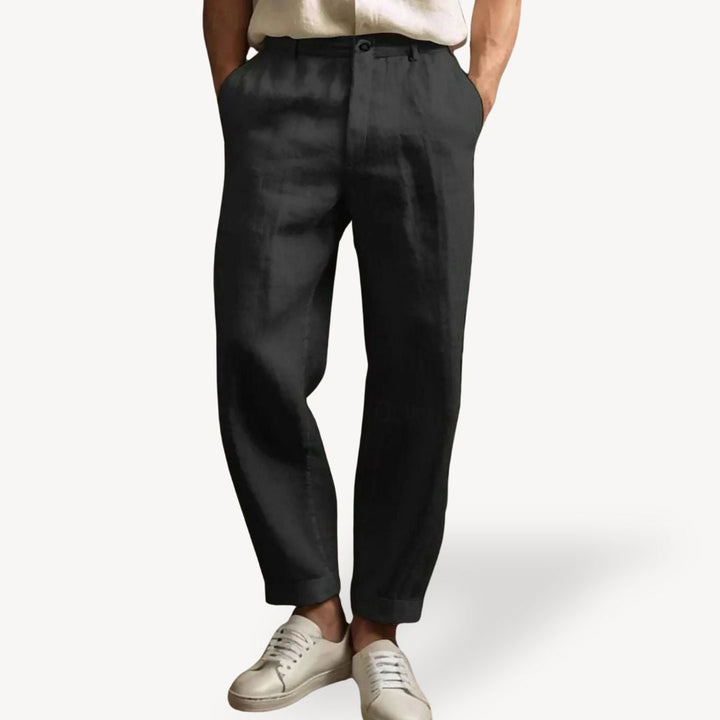"Men's lightweight linen summer pants with side pockets, available in black, green, white, and khaki, shown in relaxed fit."