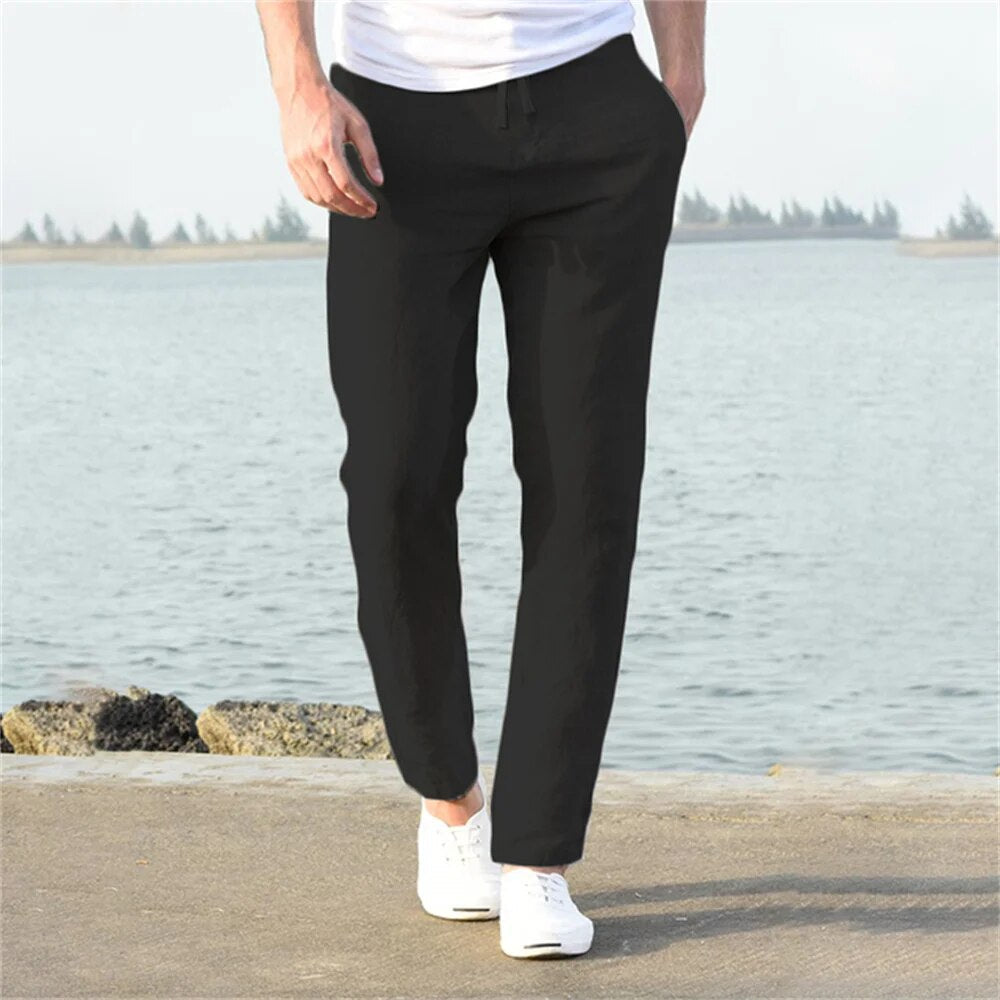 Men's lightweight linen trousers, casual and versatile, in light blue, showcasing a modern, relaxed fit and breathable fabric