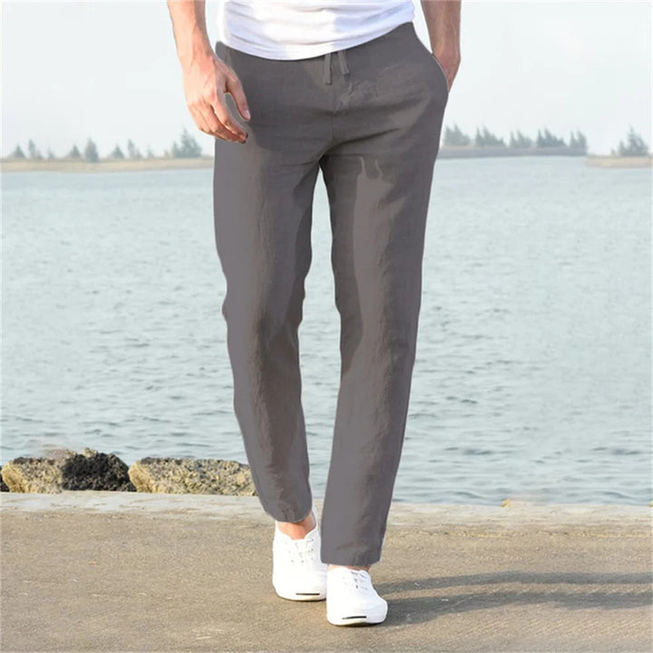 Men's lightweight linen trousers, casual and versatile, in light blue, showcasing a modern, relaxed fit and breathable fabric