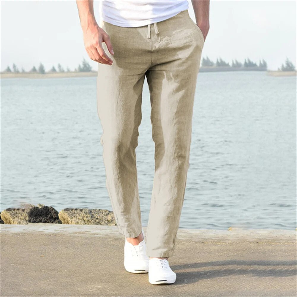 Men's lightweight linen trousers, casual and versatile, in light blue, showcasing a modern, relaxed fit and breathable fabric