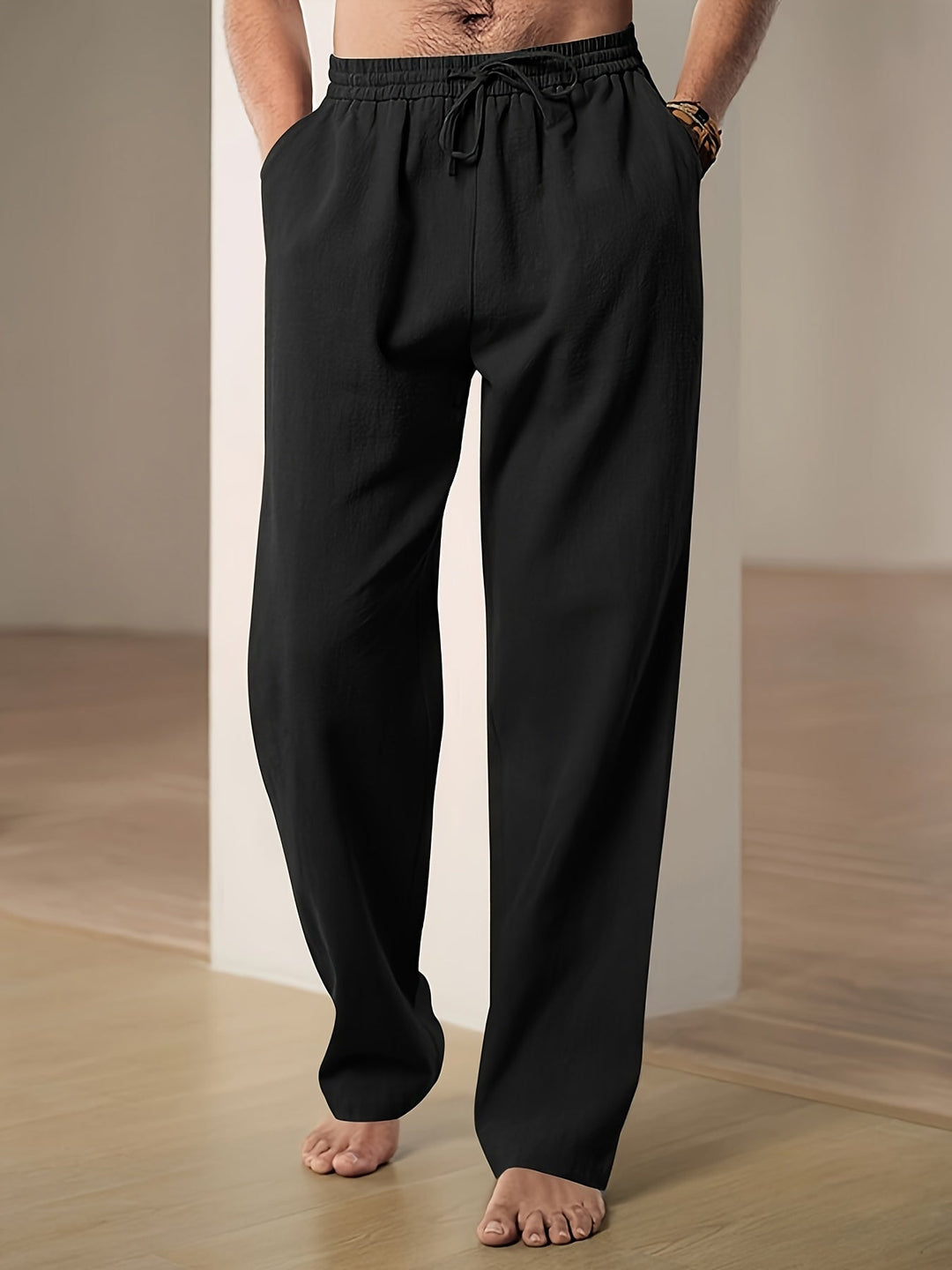 "Men's lightweight relaxed fit lounge trousers with drawstring waist, breathable fabric, shown in stylish grey tone."