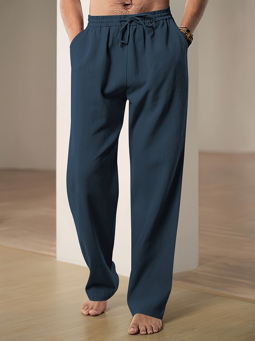 "Men's lightweight relaxed fit lounge trousers with drawstring waist, breathable fabric, shown in stylish grey tone."