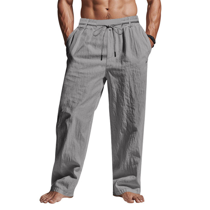 "Men's linen trousers with drawstring waist, relaxed fit, lightweight breathable fabric, ideal for casual and sunny days."