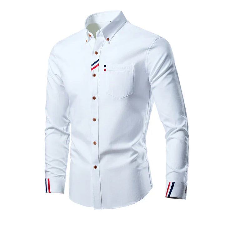 Men's long-sleeve cotton shirt with button-down front, structured collar, and classic style for sophisticated daily wear.