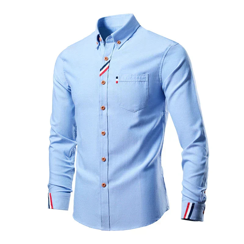 Men's long-sleeve cotton shirt with button-down front, structured collar, and classic style for sophisticated daily wear.