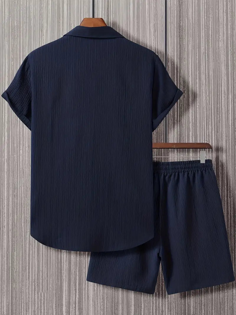 Men's navy blue button-up shirt and shorts set, relaxed fit, notched collar, drawstring waist, effortless style.