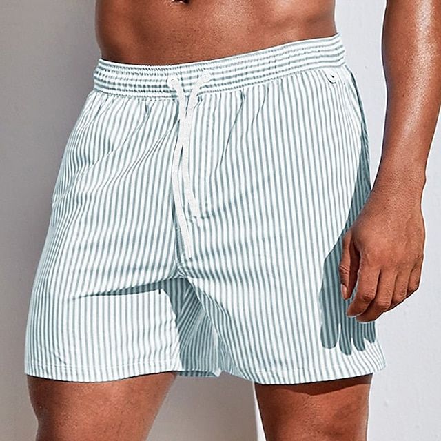 "Men's quick-dry blue striped boardshorts swimwear; lightweight with elastic waistband for beach or pool adventures."