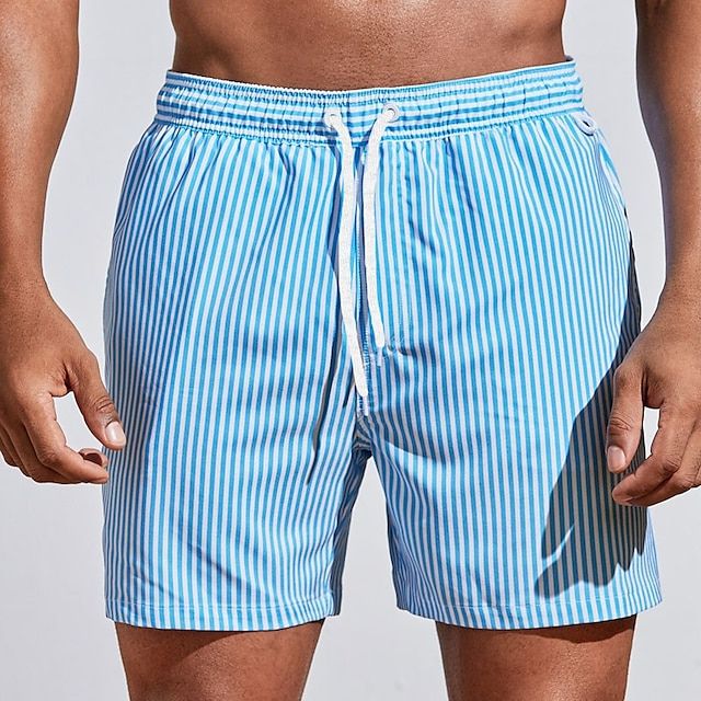 "Men's quick-dry blue striped boardshorts swimwear; lightweight with elastic waistband for beach or pool adventures."