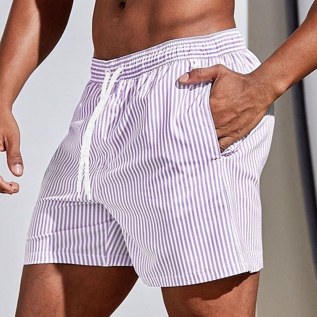"Men's quick-dry blue striped boardshorts swimwear; lightweight with elastic waistband for beach or pool adventures."