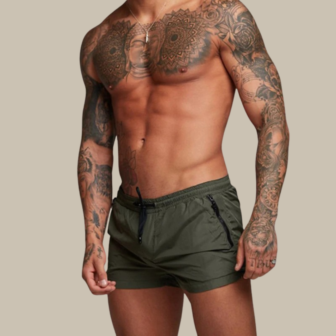 "Men's quick-dry, stretchy swim shorts with pockets in vibrant colors, featuring an elastic waistband and sleek design."