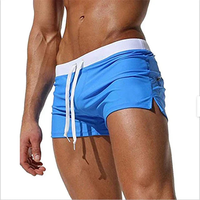 "Men's quick-dry swim shorts with adjustable waistband, sleek design, side slits, and drawstring closure for swim comfort."