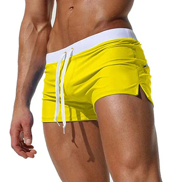 "Men's quick-dry swim shorts with adjustable waistband, sleek design, side slits, and drawstring closure for swim comfort."