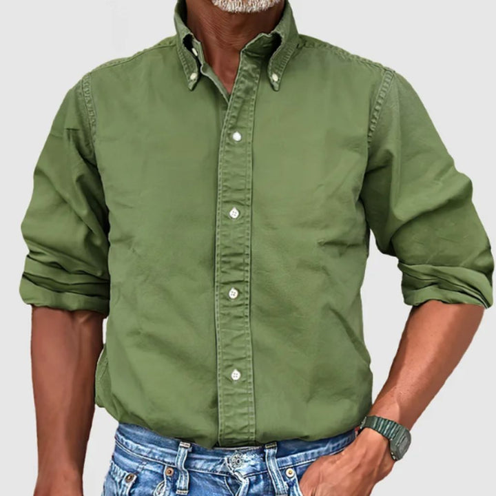 "Men's regular fit long-sleeve button-down shirt with classic collar, rolled cuffs, and durable polyester fabric."