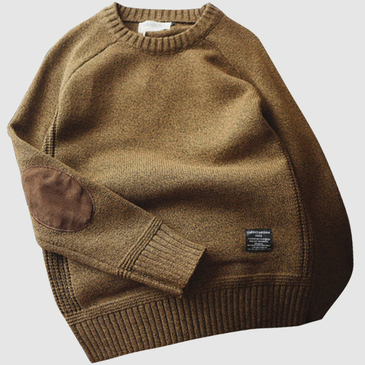 Men's regular fit wool blend sweater with elbow patch, showcasing a classic design ideal for smart-casual or relaxed looks.
