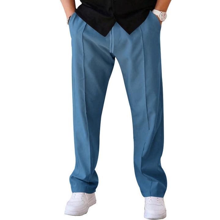 "Men's relaxed linen trousers, wide-leg, breathable, versatile colors like beige, black, blue; perfect comfort and style"