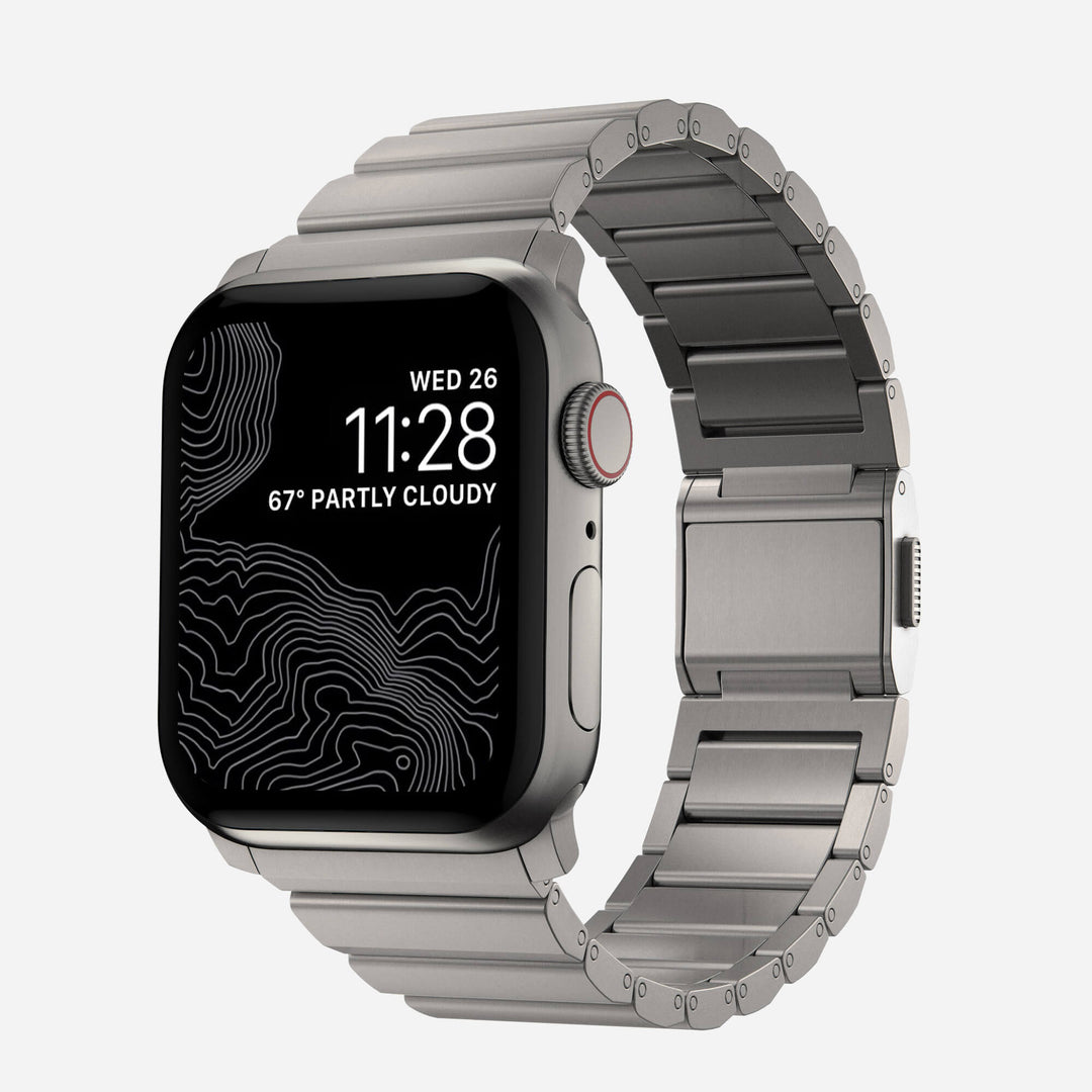Men's sleek titanium watch band with shiny finish, magnetic clasp, durable and lightweight; perfect for daily or formal wear.