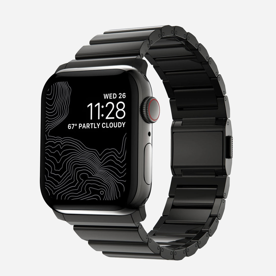 Men's sleek titanium watch band with shiny finish, magnetic clasp, durable and lightweight; perfect for daily or formal wear.
